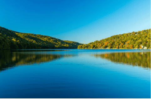 Calm Lake with Woods and Mountains